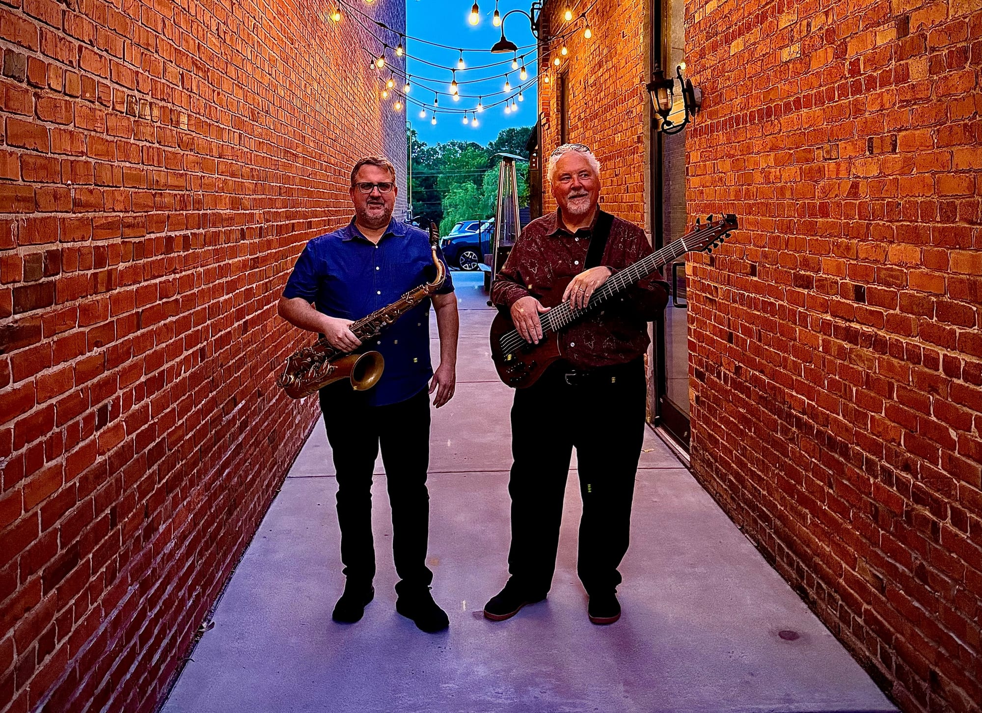 Rob Denty and Paul Westlake in a brick alley